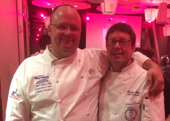 Chef Chris Villa in chef whites embroidered Executive Chef · Culinary Educator